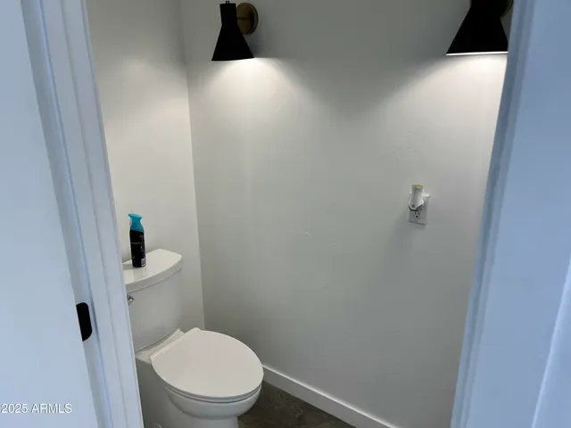 a view of a chairs and table on the wooden floor