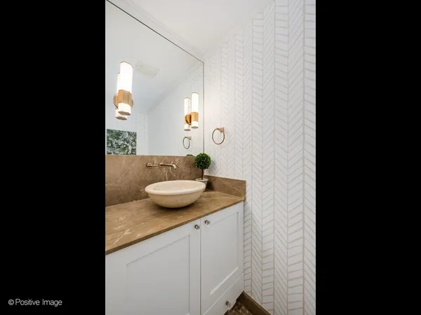 a view of a bathroom with sink and mirror