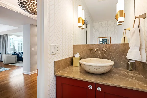 a bathroom with a sink a toilet and shower curtain