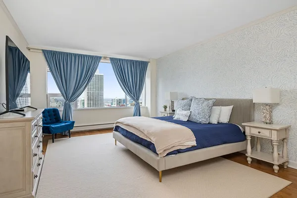 a bedroom with a bed and a cabinets