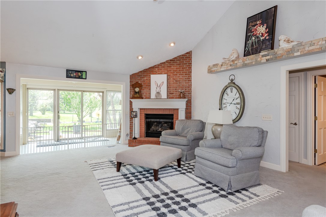 159 East Lytle 5 Points Road Springboro, OH 45066 - Photo 27 of 45 This inviting living area features a brick fireplace, vaulted ceilings, and direct access to a patio.