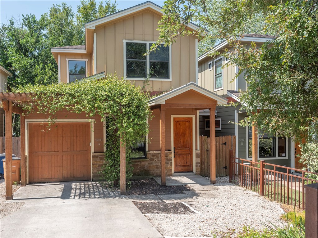 3003 Lovell Drive, Unit A Austin, TX 78723 - Photo 1 of 1 a front view of a house with a garden