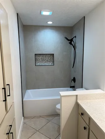 a bathroom with a sink a bathtub and a shower
