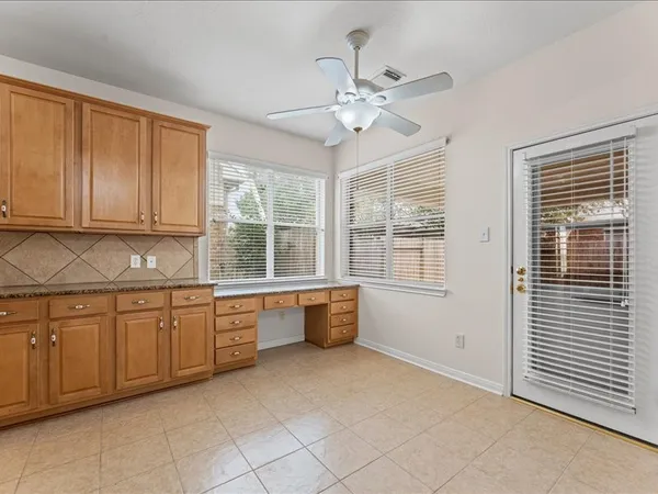 a large kitchen with a large window