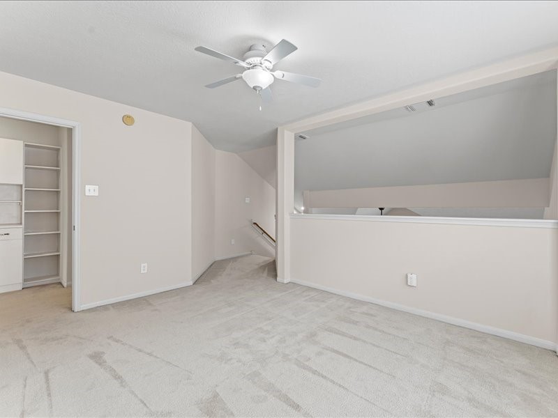 3323 Sainte Mere Eglise Lane Spring, TX 77388 - Photo 23 of 33 an empty room with a ceiling fan and a window