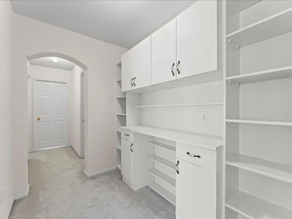 a view of an empty walk in closet