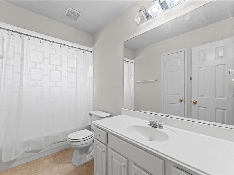 3323 Sainte Mere Eglise Lane Spring, TX 77388 - Photo 25 of 33 a bathroom with a sink a toilet and shower