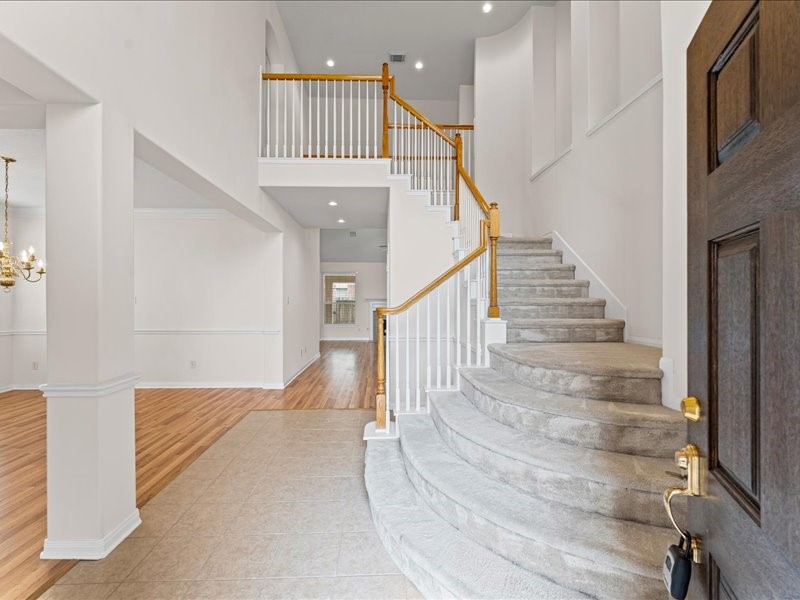 3323 Sainte Mere Eglise Lane Spring, TX 77388 - Photo 6 of 33 a view of entryway and hall with wooden floor
