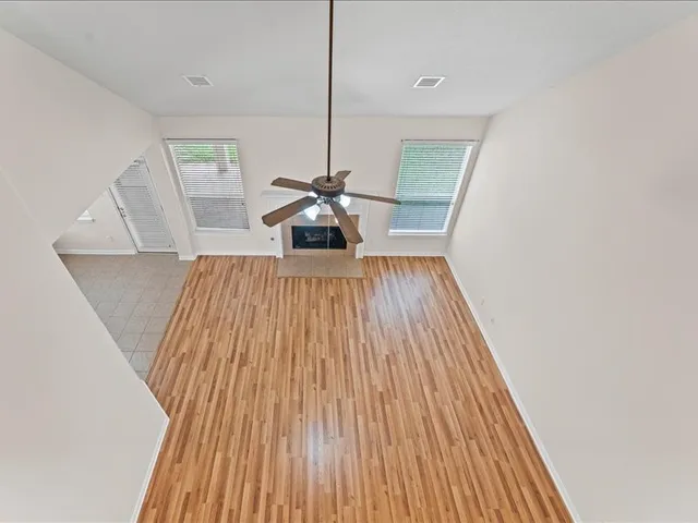 a view of wooden floor in an empty room