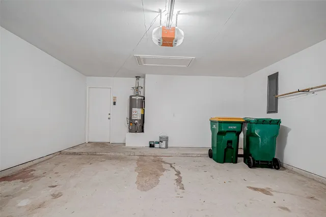 a view of a backyard with wooden fence