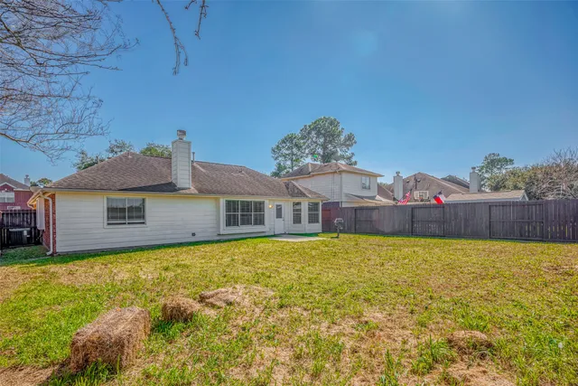 a front view of house with yard and trees