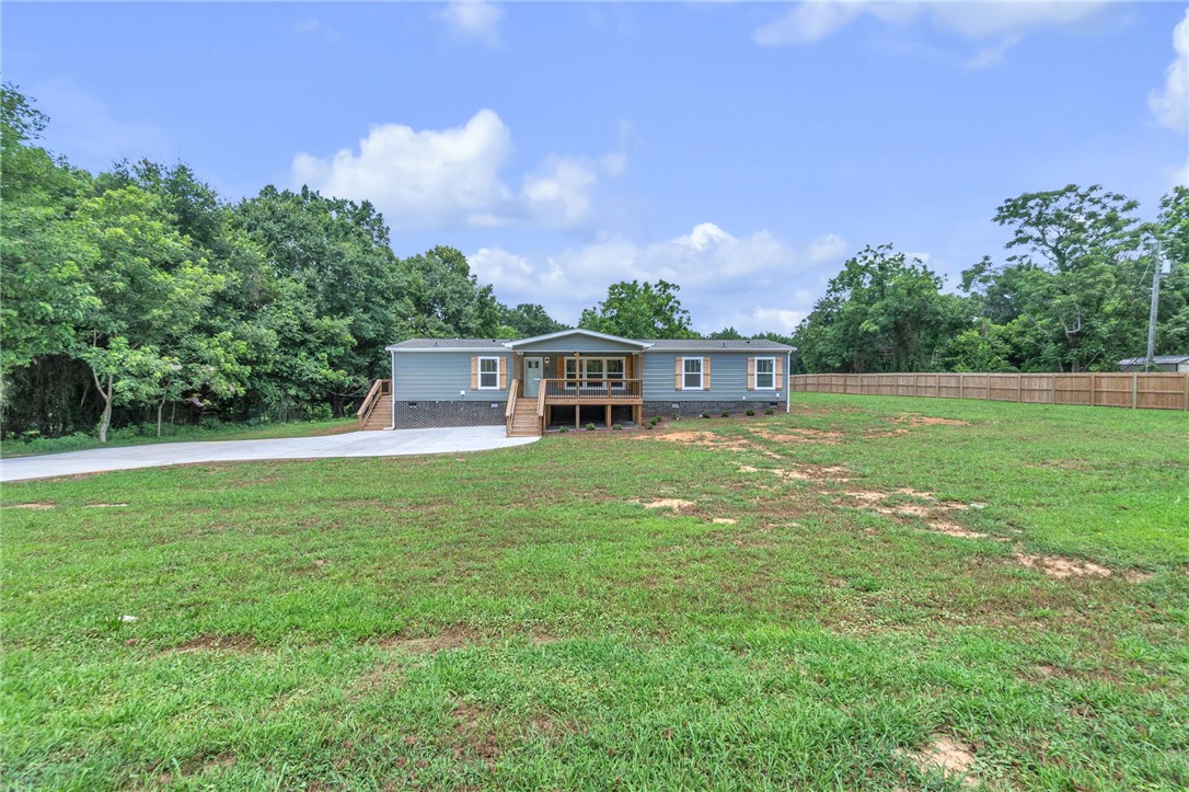 108 Old River Road Iva, SC 29655 - Photo 1 of 31 A welcoming front porch enhances this charming modular home set amidst a spacious yard.