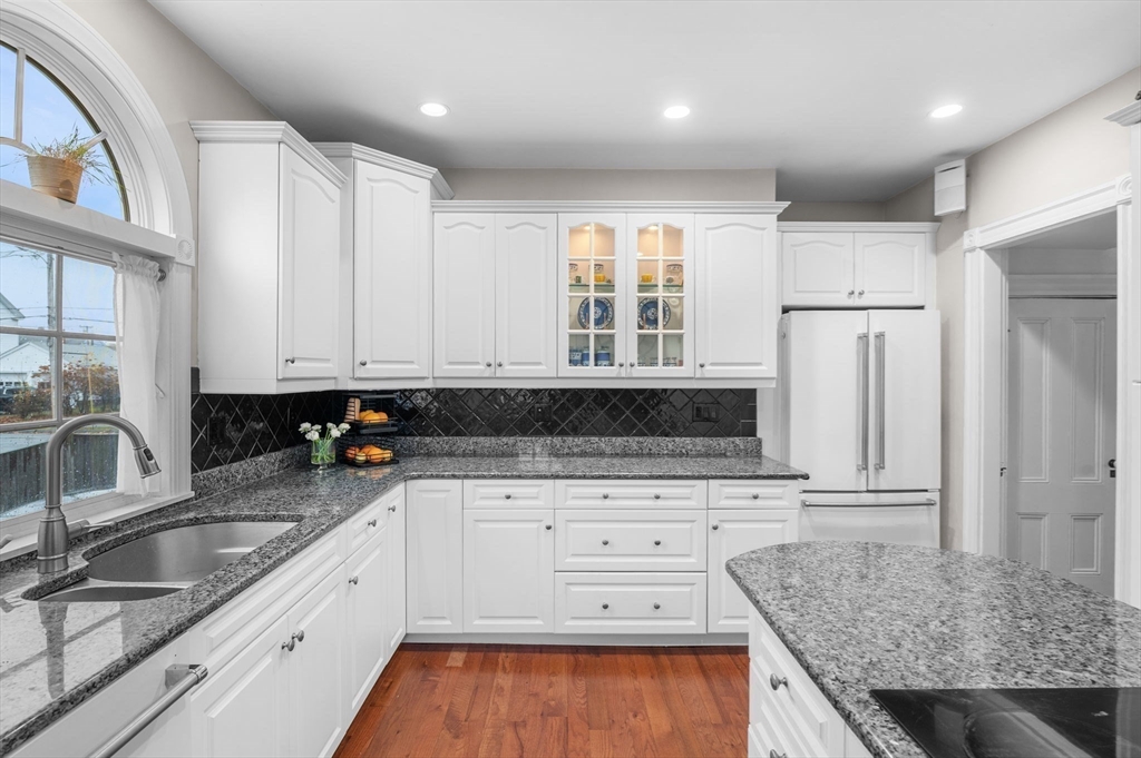5 Beacon Street Danvers, MA 01923 - Photo 12 of 37 a kitchen with granite countertop a sink stainless steel appliances and cabinets