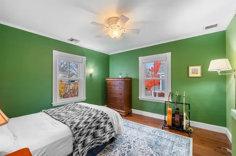 a bedroom with a bed and a television