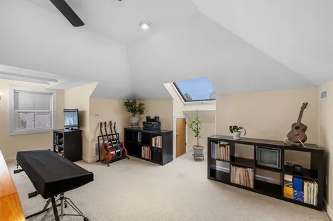 a view of a livingroom with furniture and a window