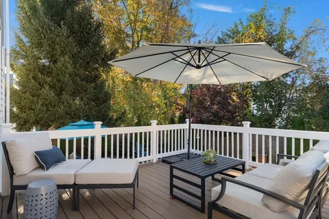 a view of a table and chairs on the deck