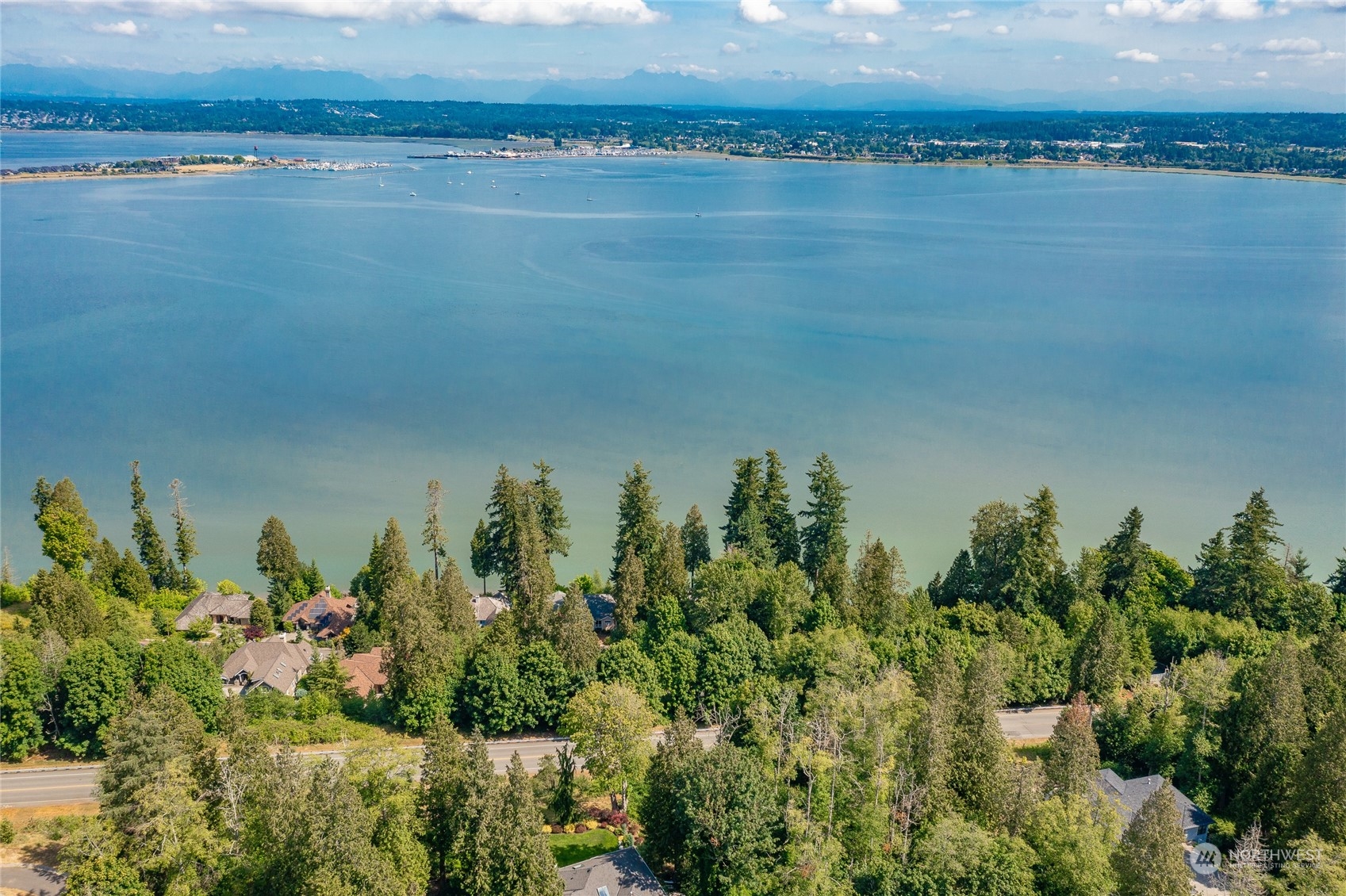5382 Canvasback Road Blaine, WA 98230 - Photo 6 of 29 a view of a lake with a mountain in the background