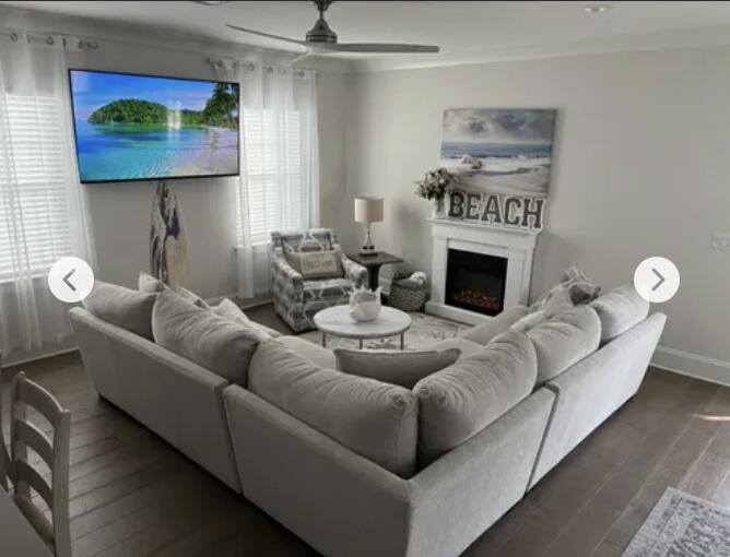 80 Heron's Crossing Santa Rosa Beach, FL 32459 - Photo 2 of 8 a living room with furniture and a fireplace
