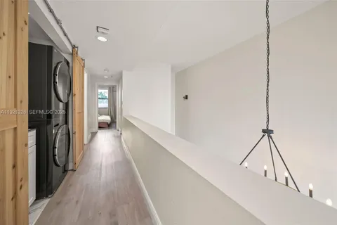a view of hallway with wooden floor