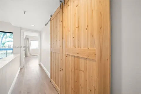 a view of a bathroom with shower and windows