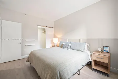 a bedroom with a bed and a closet