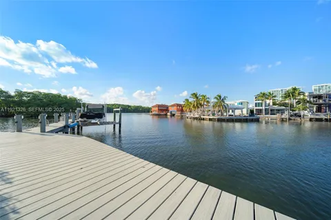 an aerial view of a house with a garden and plants