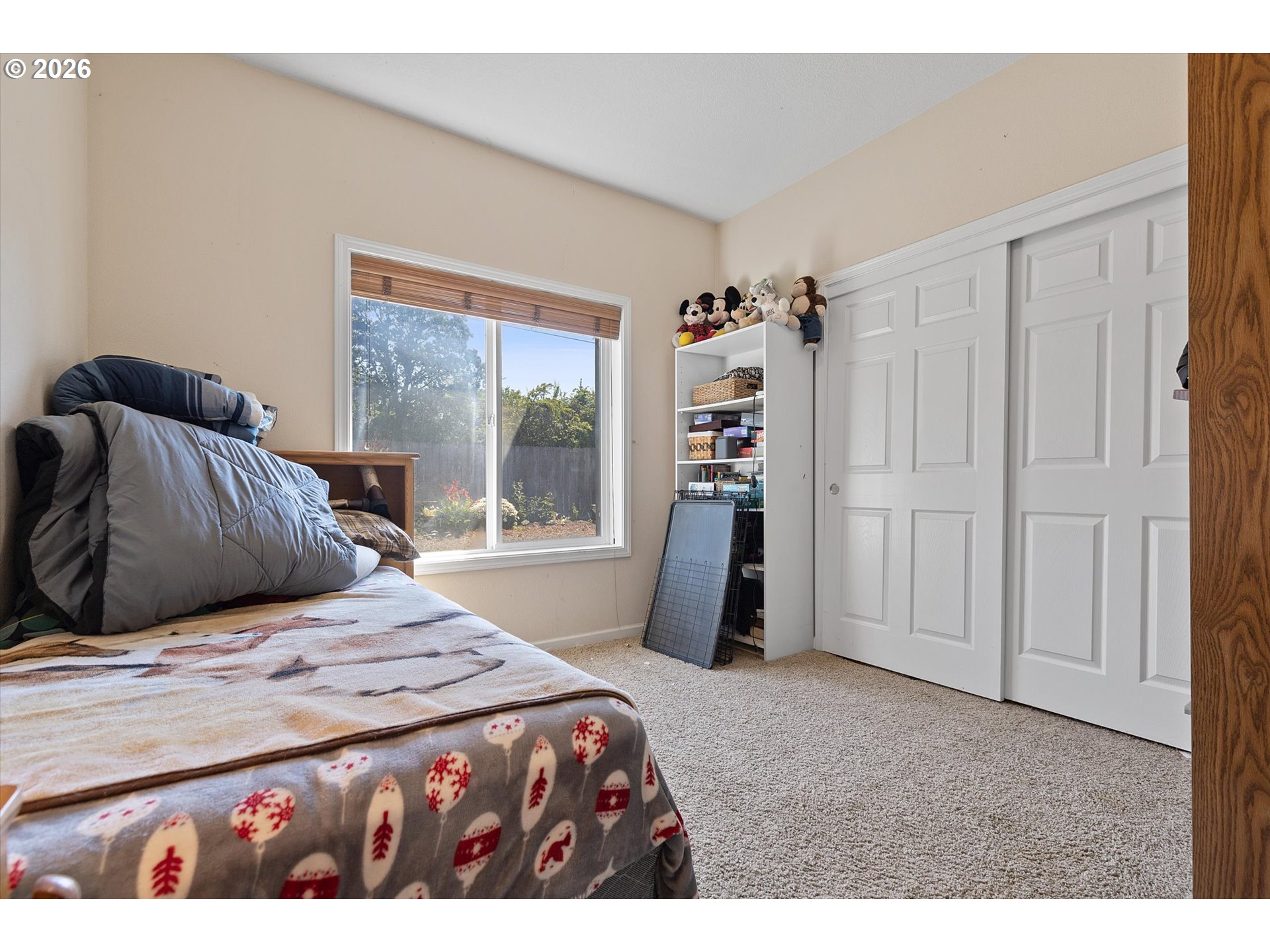 23455 Northeast Spring Hill Road Gaston, OR 97119 - Photo 24 of 48 a bedroom with a bed and a window