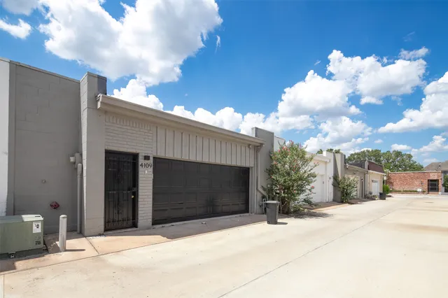 a front view of a house with a garage