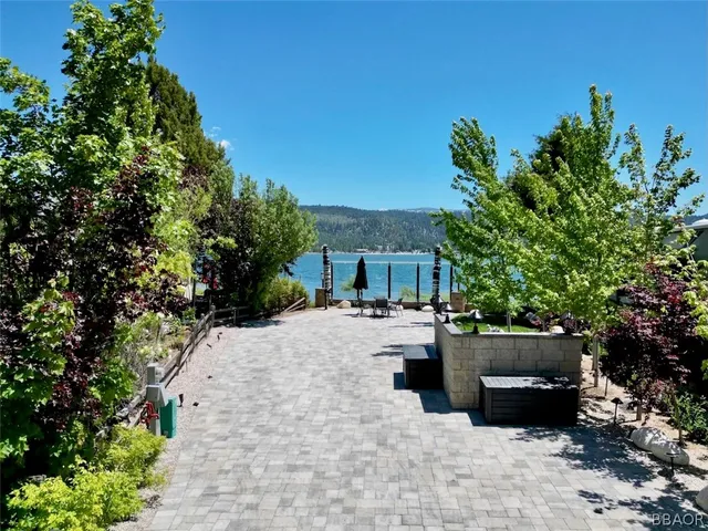 a view of a patio with couches and potted plants