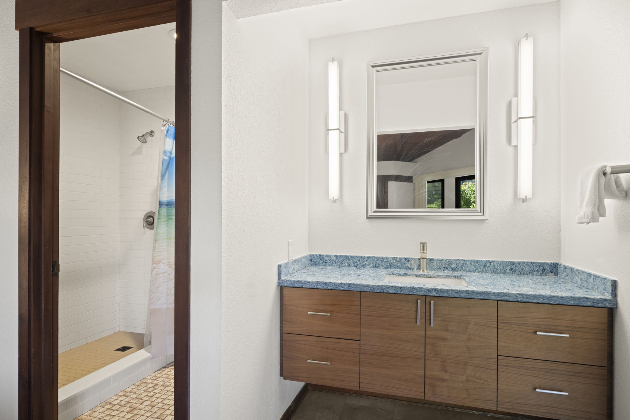 1870 Hoone Road, Unit 831 Koloa, HI 96756 - Photo 13 of 30 a bathroom with a granite countertop sink and a mirror