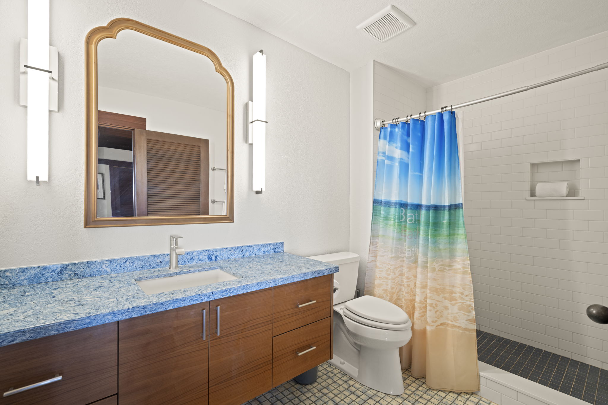 1870 Hoone Road, Unit 831 Koloa, HI 96756 - Photo 17 of 30 a bathroom with a granite countertop sink toilet and shower