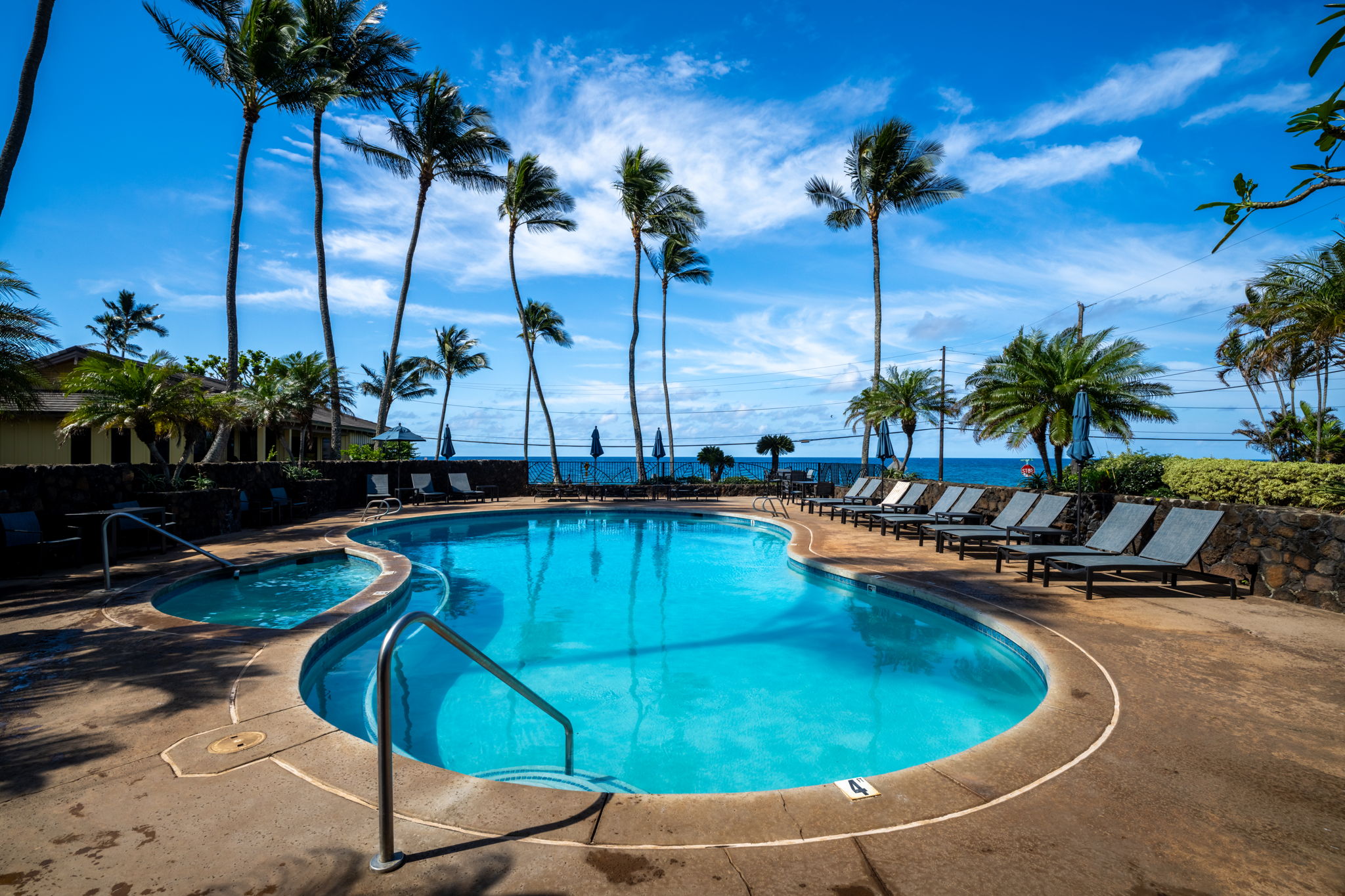 1870 Hoone Road, Unit 831 Koloa, HI 96756 - Photo 23 of 30 a view of a swimming pool with a yard
