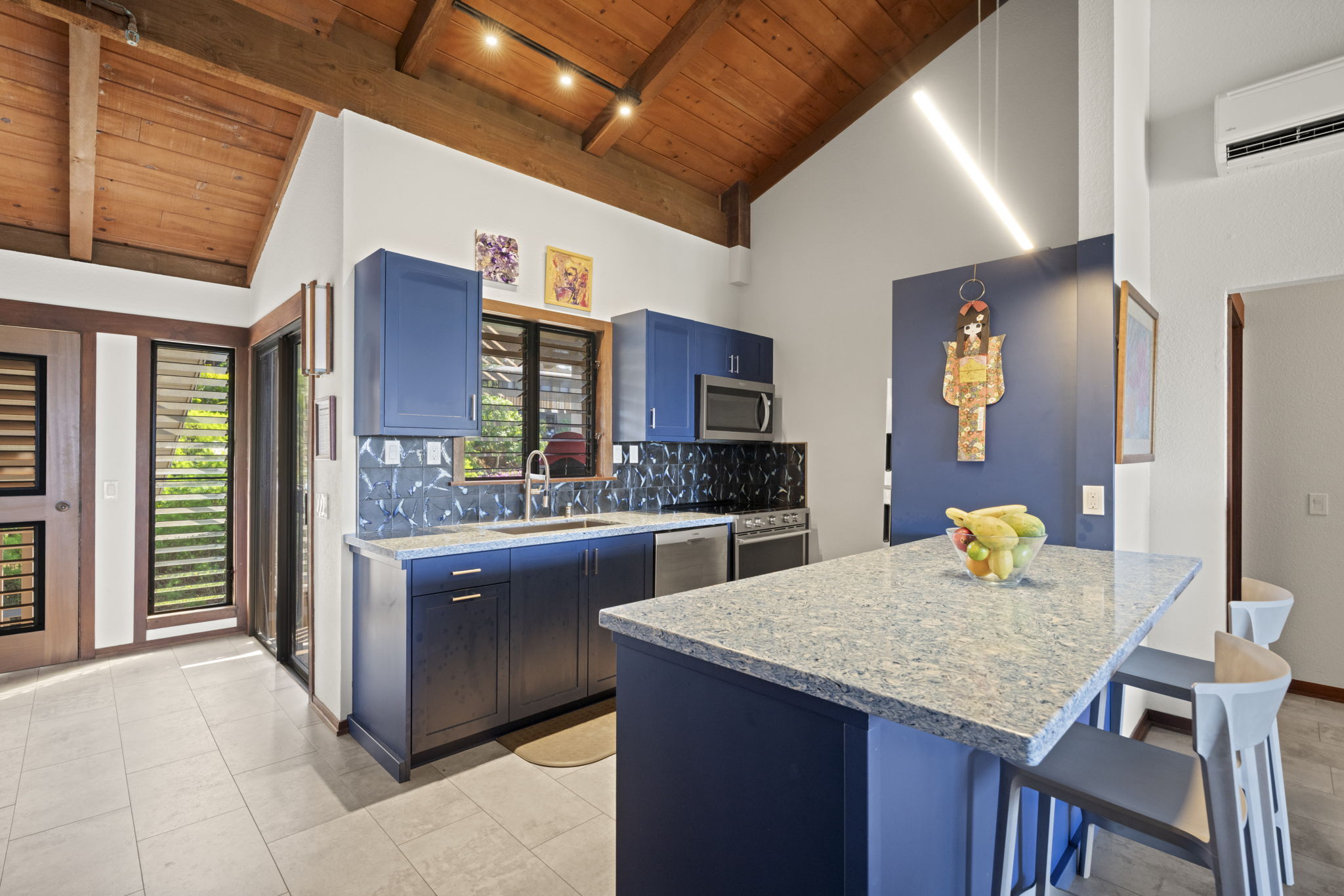 1870 Hoone Road, Unit 831 Koloa, HI 96756 - Photo 7 of 30 a kitchen with granite countertop kitchen island stainless steel appliances a sink and counter space