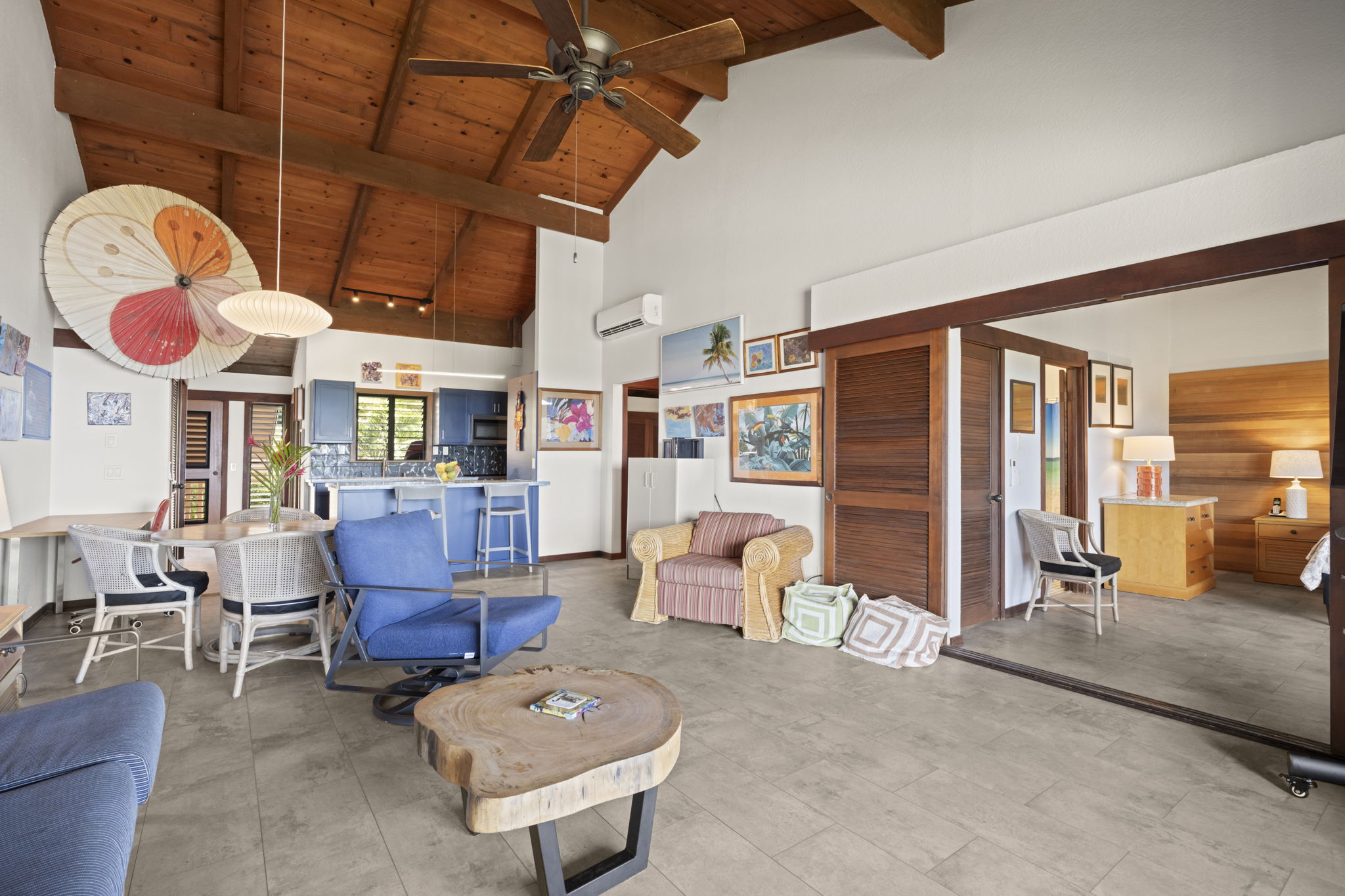 1870 Hoone Road, Unit 831 Koloa, HI 96756 - Photo 10 of 30 a living room with furniture a rug and a large window