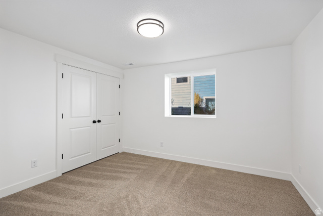 1139 South 4475 West West Point, UT 84015 - Photo 26 of 33 Unfurnished bedroom with carpet and a closet