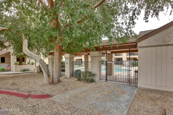 a swimming pool view with a outdoor seating space