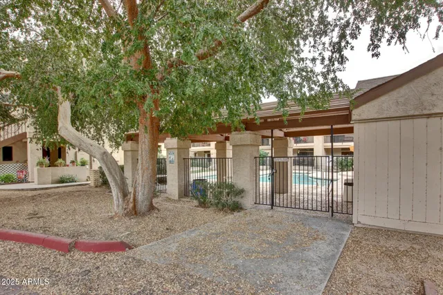 a swimming pool view with a outdoor seating space
