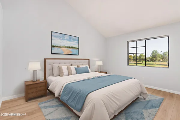 a bedroom with a bed and a window