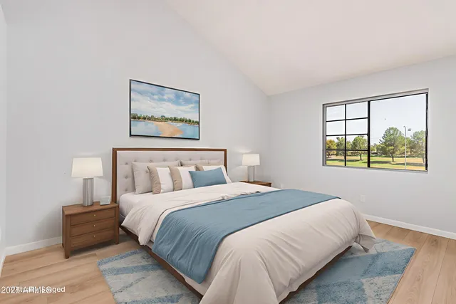 a bedroom with a bed and a window