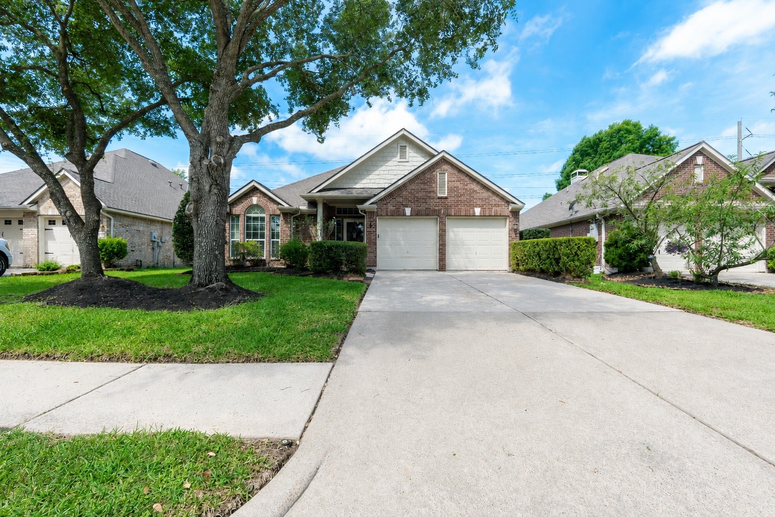 10619 Crownsedge Drive Spring, TX 77379 - Photo 2 of 38 Cozy brick one story home with well maintained lawn and large trees providing great shade.