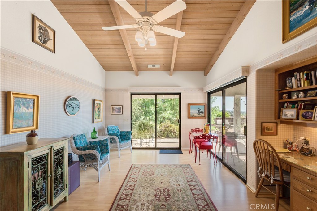 711 Tumble Creek Lane Fallbrook, CA 92028 - Photo 16 of 66 Second dining area with built in desk. The California room is through the sliding doors to the right.