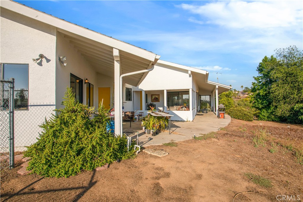 711 Tumble Creek Lane Fallbrook, CA 92028 - Photo 41 of 66 View from outside the 4th bedroom looking to the California room and the back patio.