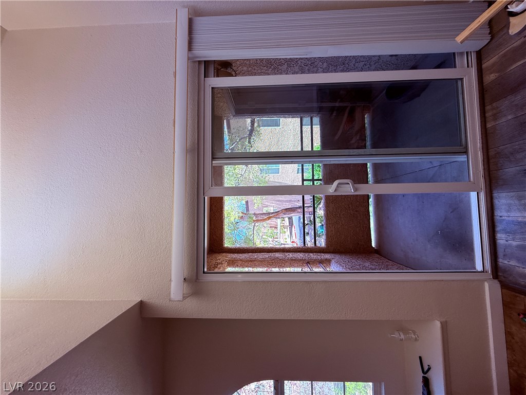 9325 West Desert Inn Road, Unit 260 Las Vegas, NV 89117 - Photo 27 of 42 Natural light illuminates this interior space through a generously sized window overlooking the exterior.