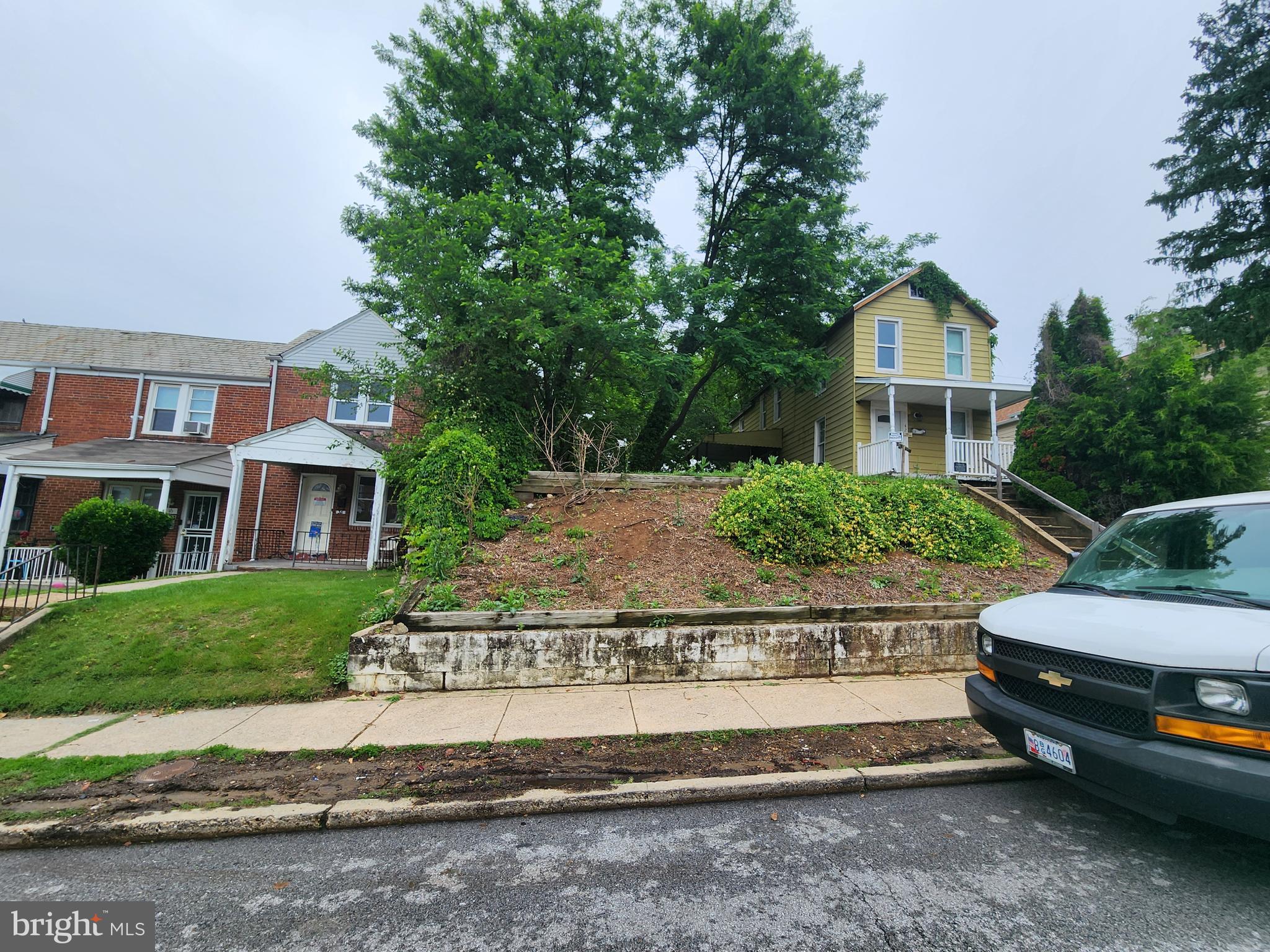 Parcel On Parcel On Monastery Baltimore, MD 21229 - Photo 3 of 4 a front view of a house with a garden