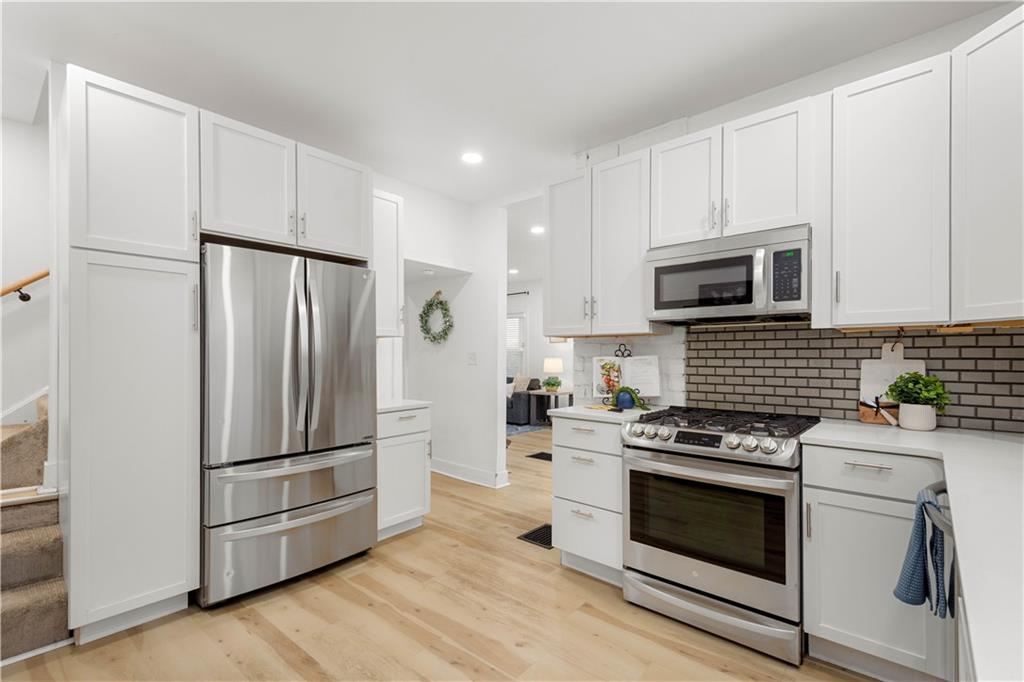 285 Patterson Avenue Bridgeville, PA 15017 - Photo 11 of 33 Pantry cabinetry surrounds the stainless steel refrigerator.