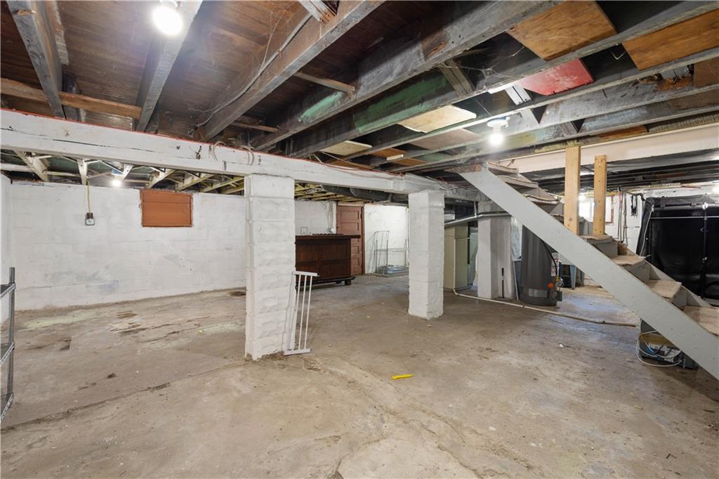 285 Patterson Avenue Bridgeville, PA 15017 - Photo 26 of 33 Laundry area is located behind the stairs. Plenty of space for a home gym, storage or man cave.