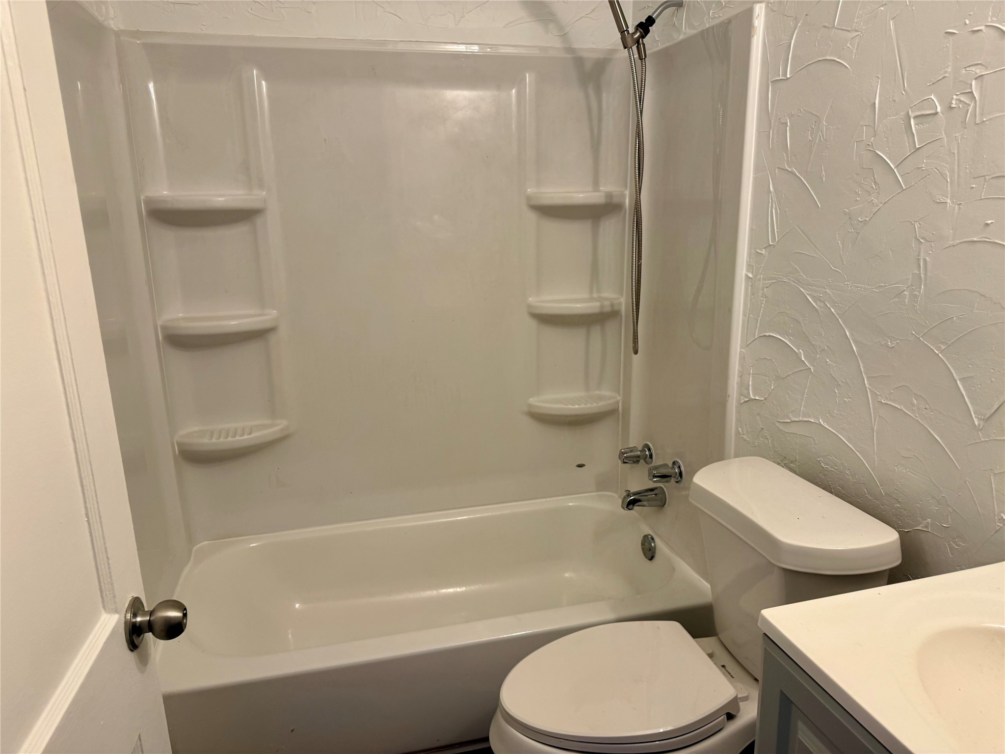 5326 Wenda Street Houston, TX 77033 - Photo 5 of 9 a bathroom with a toilet and a shower