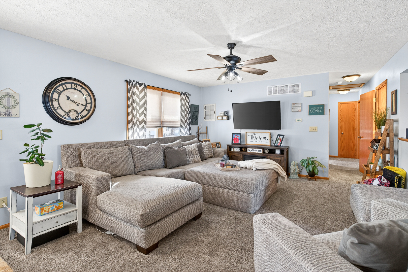 2712 North 13th Street Clinton, IA 52732 - Photo 12 of 47 a living room with furniture a window and a flat screen tv