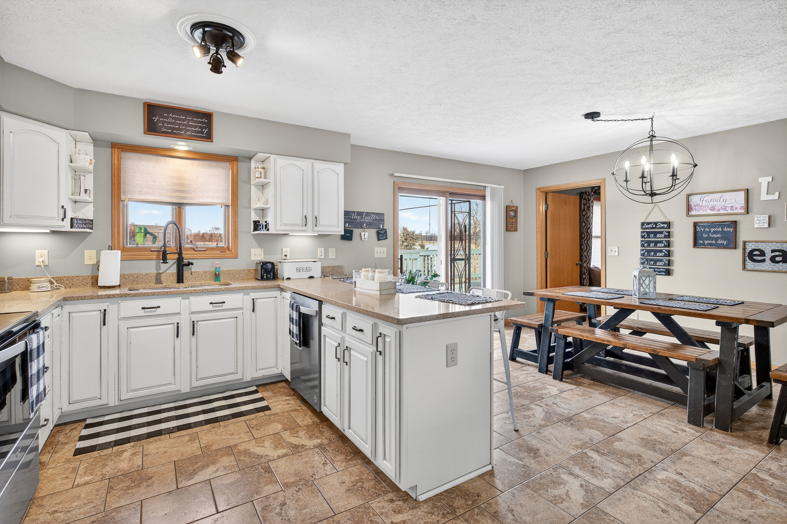 2712 North 13th Street Clinton, IA 52732 - Photo 15 of 47 a kitchen with granite countertop a sink and cabinets