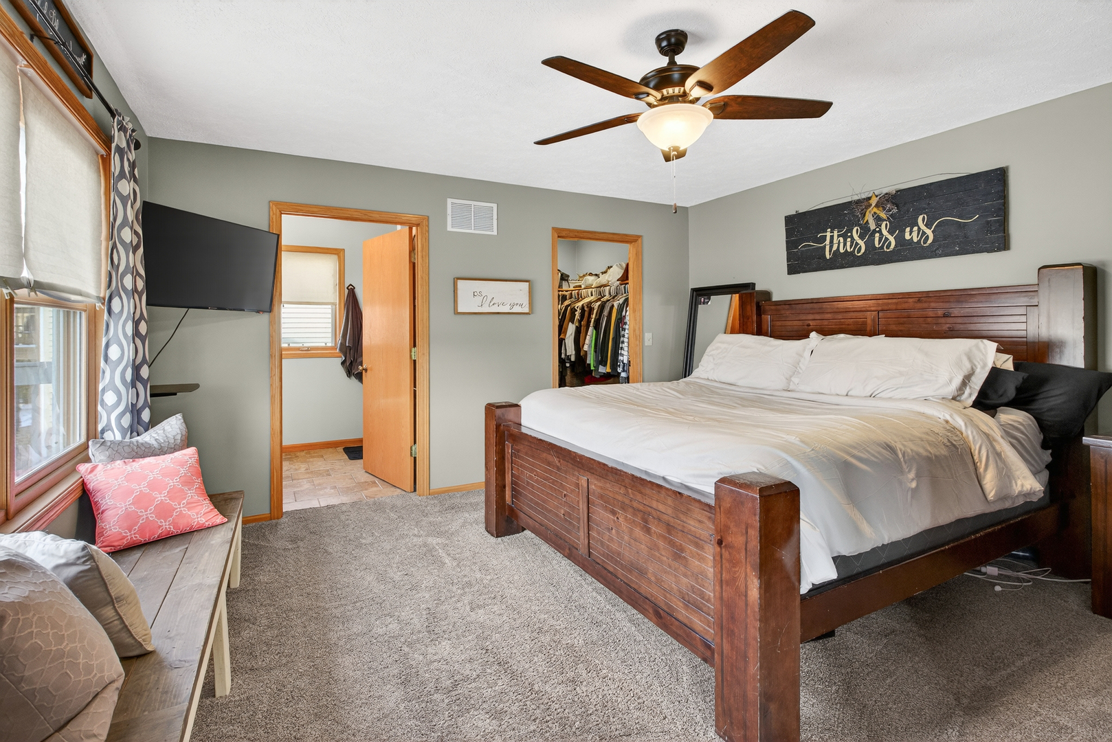 2712 North 13th Street Clinton, IA 52732 - Photo 18 of 47 a bedroom with a bed and a chandelier